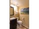 Half bathroom with modern vanity, toilet, and decorative artwork at 1881 Alma Ln, Superior, CO 80027