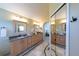 Bathroom featuring double sinks, granite countertops, and framed mirrors at 1881 Alma Ln, Superior, CO 80027