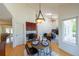 Bright dining area open to the living room featuring a vaulted ceiling and access to the deck at 1881 Alma Ln, Superior, CO 80027