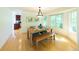 Bright dining area featuring a wood table, bench seating, and a large window overlooking the backyard at 1881 Alma Ln, Superior, CO 80027