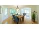 Dining room with natural light, wood table and chairs, and views into another living area at 1881 Alma Ln, Superior, CO 80027