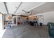 Spacious garage with ample room for parking and storage, featuring shelving, overhead lighting, and convenient access to the home at 1881 Alma Ln, Superior, CO 80027