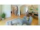 Open-concept living room with hardwood floors, staircase, and a glimpse into the dining area at 1881 Alma Ln, Superior, CO 80027