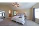 The main bedroom has vaulted ceilings, carpet, and is brightly lit with windows and recessed lighting at 1881 Alma Ln, Superior, CO 80027
