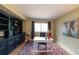 Home office featuring built-in shelves, a neutral color palette, and a decorative rug at 1881 Alma Ln, Superior, CO 80027