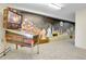 Basement featuring a pinball machine and a mural on the wall at 11333 Conifer Mountain Rd, Conifer, CO 80433