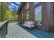 Outdoor deck with cozy seating, ideal for peaceful retreats with nature at 11333 Conifer Mountain Rd, Conifer, CO 80433