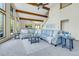Inviting living area with plush furniture, ceiling beams, and mountain views at 11333 Conifer Mountain Rd, Conifer, CO 80433