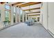 Bright living room with beamed ceilings, large windows, and mountain views at 11333 Conifer Mountain Rd, Conifer, CO 80433