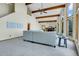 Large living room with vaulted ceilings, wood beams, and natural light at 11333 Conifer Mountain Rd, Conifer, CO 80433