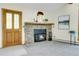 Inviting living room features a stone fireplace and natural light at 11333 Conifer Mountain Rd, Conifer, CO 80433