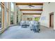 Spacious living room with exposed beams, a ceiling fan, and many windows at 11333 Conifer Mountain Rd, Conifer, CO 80433