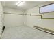 Utility room with tile floors and a window at 11333 Conifer Mountain Rd, Conifer, CO 80433