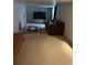Large basement with a sofa and television, offering a comfortable and versatile living space at 18336 E Amherst Dr, Aurora, CO 80013