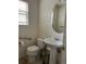 Bathroom features a sink, toilet, and window at 18336 E Amherst Dr, Aurora, CO 80013