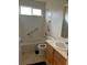 Functional bathroom with a shower-tub, toilet, and vanity at 18336 E Amherst Dr, Aurora, CO 80013