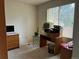 Bright office space with a large window and desk area, perfect for working from home at 18336 E Amherst Dr, Aurora, CO 80013