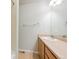 Bathroom with a single sink vanity, large mirror, and shower with tile surround at 9300 E Florida Ave # 1506, Denver, CO 80247