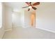 Bright bedroom with neutral walls, carpet floors, ceiling fan, and access to en-suite bathroom at 9300 E Florida Ave # 1506, Denver, CO 80247