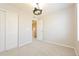 Neutral bedroom with light carpet, ceiling fan, and closet perfect for comfortable living at 9300 E Florida Ave # 1506, Denver, CO 80247