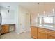 Modern kitchen with breakfast bar, sleek countertops, stainless steel refrigerator and pendant lighting at 9300 E Florida Ave # 1506, Denver, CO 80247