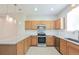 Beautiful kitchen featuring granite countertops, wooden cabinets, and stainless steel appliances at 9300 E Florida Ave # 1506, Denver, CO 80247