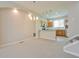 Open-concept design shows modern kitchen with pendant lights adjacent to living and dining area at 9300 E Florida Ave # 1506, Denver, CO 80247