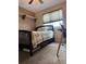 Bedroom featuring a twin bed, closet, and a window at 5201 E 127Th Dr, Thornton, CO 80241