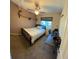 Bedroom features a bed, desk, and natural light from the window at 5201 E 127Th Dr, Thornton, CO 80241