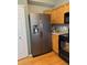 Functional kitchen featuring stainless steel appliances, wooden cabinets, and laminate countertops at 5201 E 127Th Dr, Thornton, CO 80241