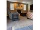Living room features a fireplace, an accent wall, carpet, and natural light at 5201 E 127Th Dr, Thornton, CO 80241