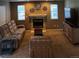 Living room features comfortable furniture, fireplace, and a TV at 5201 E 127Th Dr, Thornton, CO 80241