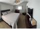 Spacious main bedroom features vaulted ceiling, ceiling fan, comfortable bed, and abundant natural light from window at 5201 E 127Th Dr, Thornton, CO 80241