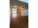 Open concept living space leading into a kitchen with stainless steel appliances and wood cabinets at 6396 S Hill St, Littleton, CO 80120