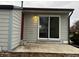 Rear view of patio with siding and sliding glass door to house at 6396 S Hill St, Littleton, CO 80120