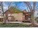 Backyard includes a patio set on a stone patio and a view of the home's back exterior at 673 Brentwood St, Lakewood, CO 80214