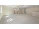 Spacious basement with new carpet, neutral paint, and recessed lighting at 673 Brentwood St, Lakewood, CO 80214