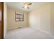 Neutral bedroom with carpeted floors, natural light, and a ceiling fan at 673 Brentwood St, Lakewood, CO 80214