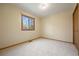 Neutral bedroom with carpeted floors and natural light from a window at 673 Brentwood St, Lakewood, CO 80214