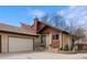Charming home featuring a covered front porch, two car garage, and low-maintenance landscaping at 673 Brentwood St, Lakewood, CO 80214