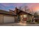 Charming home featuring a covered front porch, two car garage, and low-maintenance landscaping at 673 Brentwood St, Lakewood, CO 80214