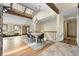 Open floor plan featuring hardwood floors, skylights, and an adjacent dining area at 673 Brentwood St, Lakewood, CO 80214