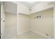 Utility room includes storage shelves and easy access to washer hookups at 673 Brentwood St, Lakewood, CO 80214