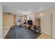 Basement workout area with rubber flooring and modern equipment at 10127 W 100Th Ct, Westminster, CO 80021