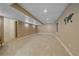 Spacious finished basement with carpet, recessed lighting and a world map accent at 10127 W 100Th Ct, Westminster, CO 80021