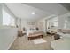 Bright bedroom features a comfortable bed, mirrored closet, and natural light from a window at 10127 W 100Th Ct, Westminster, CO 80021