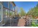 Spacious deck with seating, a fire pit, and beautiful views of the backyard and trees at 10127 W 100Th Ct, Westminster, CO 80021