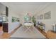 Bright dining room with hardwood floors, modern decor, and large windows, creating an elegant dining space at 10127 W 100Th Ct, Westminster, CO 80021