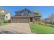 Charming two-story home with a well-maintained lawn and an attached two-car garage, perfect for Gathering living at 10127 W 100Th Ct, Westminster, CO 80021