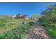 Exterior view of a home with a well-maintained lawn, walking path, and beautiful landscaping at 10127 W 100Th Ct, Westminster, CO 80021